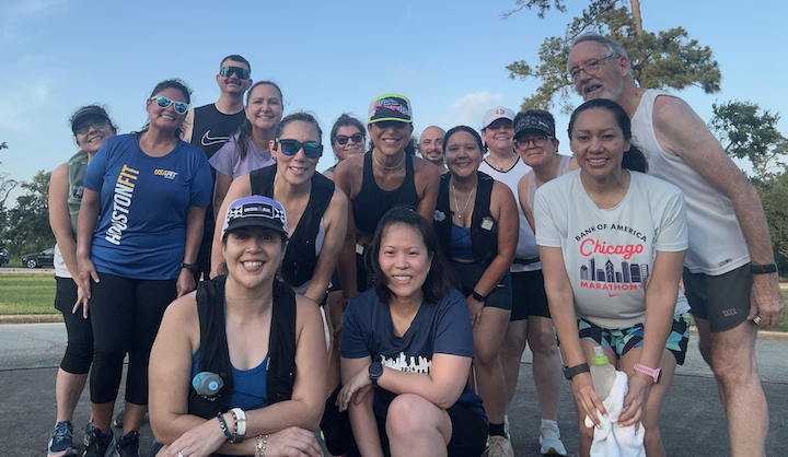 Group of runners smiling.